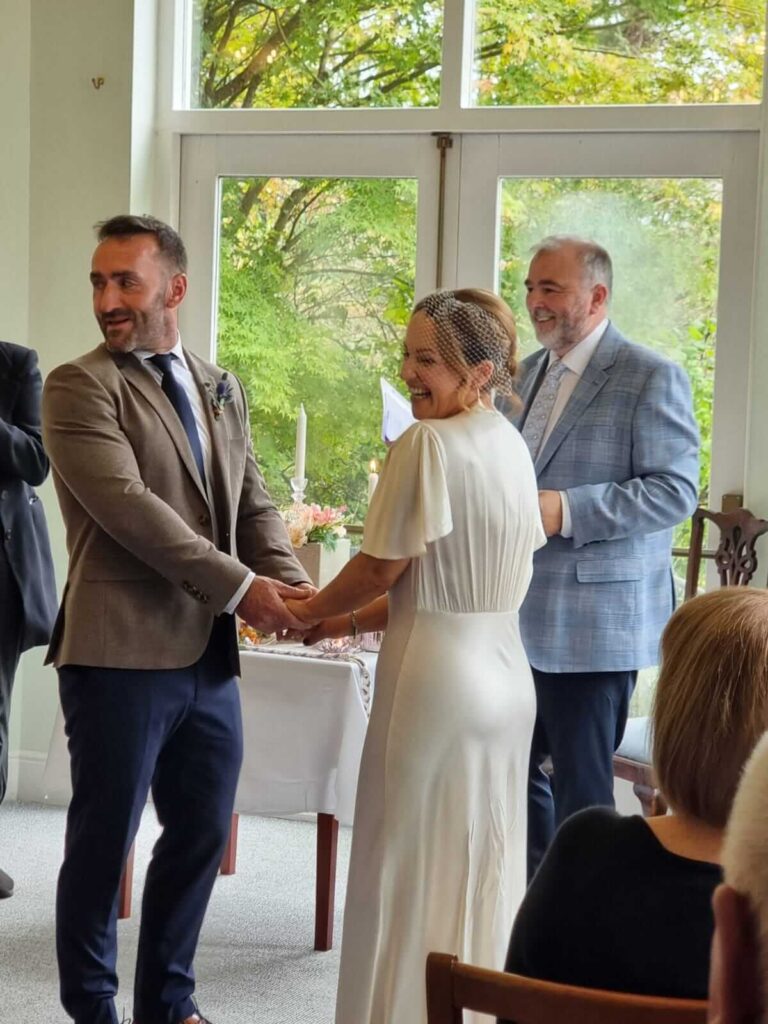 Olivia & Andrew marry at Seaview House with Celebrant Brian Twomey and Ally Sherlock singing